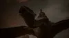 A person riding a dragon in a dark, atmospheric setting. Produktbild-Vorschau
