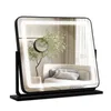A vanity mirror with integrated LED lighting, displayed on a black base against a white background.