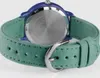 Close-up view of the back of a watch with a green fabric strap. Produktbild-Vorschau