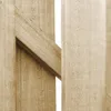 Close-up view of wooden fence panels with a diagonal support beam. Náhled obrázku produktu