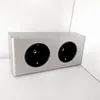 A silver double electrical outlet strip with two black sockets, placed on a white surface against a white background. Produktbild-Vorschau