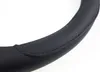 A close-up view of a black steering wheel cover. Produktbild-Vorschau