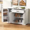 A white sideboard cabinet with its doors and drawer open, displaying its interior storage compartments and contents. Anteprima dell’immagine prodotto