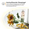 A close-up of sunflowers and a perfume bottle reflected in a mirror, with marketing text overlay. Anteprima dell’immagine prodotto