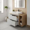 A modern bathroom vanity with a sink, drawers, and a side shelf. Anteprima dell’immagine prodotto