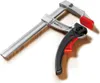 A clamp is shown on a wooden surface. Anteprima dell’immagine prodotto