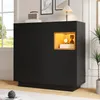 A modern black cabinet with an illuminated open shelf displaying decorative items. Podgląd zdjęcia produktu