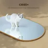 A white cat is reflected in an oval mirror with a gold frame, with text overlay. Náhled obrázku produktu