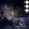 A young person is sitting on the floor, looking up at a glowing moon-like object, with a starry, ethereal background. Náhled obrázku produktu