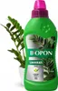A bottle of plant fertilizer next to a potted plant. Produktbild-Vorschau