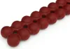 A close-up, angled view of a red spine massager on a white background. Anteprima dell’immagine prodotto