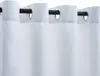 Close-up of white curtains with grommets on a black curtain rod. Náhled obrázku produktu