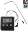A digital kitchen thermometer with a probe and a display unit, shown against a white background. The packaging is visible in the top right corner. Náhľad obrázku produktu