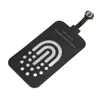 A black wireless charging receiver patch with a white and pink U-shaped design and a row of white dots. Voir les images du produit