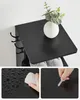 Collage of product images showing a black shoe rack and close-ups of its surface. Anteprima dell’immagine prodotto