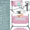 A pink baby crib with a teddy bear and a baby, shown with various features highlighted by text and icons. Produktbild-Vorschau