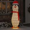 A large, illuminated penguin decoration with a Santa hat and scarf stands outside a house at night, with snow on the ground and decorations visible in a window. Náhled obrázku produktu