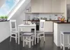 A modern kitchen with a dining set in the foreground, under a slanted ceiling with a skylight. Produktbild-Vorschau