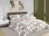 A bedroom scene with a bed dressed in a leaf-patterned duvet cover. Anteprima dell’immagine prodotto