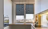 A modern kitchen with a window, blinds, and appliances. Produktbild-Vorschau