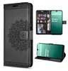A collage of images showing a black leather wallet case for a Samsung Galaxy A16 5G phone, with a mandala design on the front. One image shows the case open with cards and a photo inside, and another shows the phone inside the case. Produktbild-Vorschau