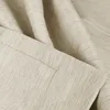 A close-up view of beige fabric with a textured weave, showing folds and seams. Produktbild-Vorschau