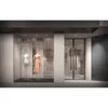 A storefront window display with mannequins and clothing. Produktbild-Vorschau