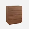 A wooden chest of drawers with four drawers against a plain background. Anteprima dell’immagine prodotto