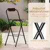 A folding bar stool is shown outdoors on a patio with plants in the background. Text overlays describe the product's features. Produktbild-Vorschau