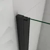 A close-up view of a black shower door frame attached to a tiled wall. Produktbild-Vorschau