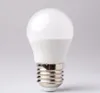 A white LED light bulb with a silver screw base against a light gray background. Podgląd zdjęcia produktu