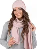 A woman wearing a pink beanie and scarf, with a grey sweater. Produktbild-Vorschau