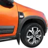 Close-up of the front fender and wheel of an orange car, showing black fender flares and a silver alloy wheel. Náhľad obrázku produktu