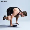 A man is performing an exercise on a balance board. Produktbild-Vorschau