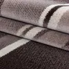 A close-up view of a folded carpet with abstract wave patterns. Náhľad obrázku produktu