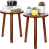 Two wooden side tables with decorative items on top. Náhled obrázku produktu
