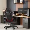 A gaming chair and desk setup in a home office environment. Voir les images du produit