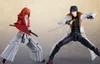 Two anime action figures are posed in a dynamic stance, as if in combat, against a plain, light-colored background. Produktbild-Vorschau
