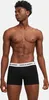 A man wearing black boxer shorts with a white waistband with the brand name printed on it. Podgląd zdjęcia produktu