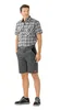 A man wearing a plaid shirt and shorts, standing against a white background. Produktbild-Vorschau