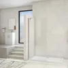 A modern bathroom with a walk-in shower, vanity, and window. Produktbild-Vorschau