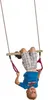 A young boy is hanging upside down from a wooden trapeze bar with purple rings. Anteprima dell’immagine prodotto