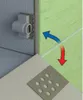 Close-up of a corner where tiles are being installed, showing a mounting bracket and arrows indicating movement. Podgląd zdjęcia produktu