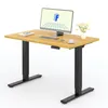 A height-adjustable desk with a monitor, keyboard, mouse, and a vase of flowers. Anteprima dell’immagine prodotto