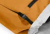 A close-up view of a yellow backpack with a black buckle and strap. Náhled obrázku produktu