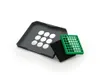 A gray tray with circular cutouts, a black filter, and a green grate are arranged on a white background. Podgląd zdjęcia produktu