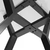 A close-up view of the underside of a round table, showing the black X-shaped metal legs and the white marble-patterned tabletop. Náhľad obrázku produktu