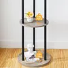 A close-up of a multi-tiered shelf unit with decorative items and weight indicators. Náhled obrázku produktu