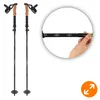 A pair of trekking poles is shown with a close-up of a hand adjusting the length of one pole, which has measurement markings. Podgląd zdjęcia produktu