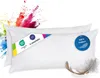 Two white feather pillows are shown with colorful powder exploding behind them. Náhľad obrázku produktu